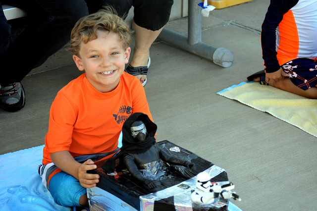 Cash Arioste, 5, shows off his Imperial boat with Kylo Ren as the pilot. Cash's boat made it safely across the pool during the 16th annual Cardboard Boat Race at the city's municipal pool. Max Lan ...