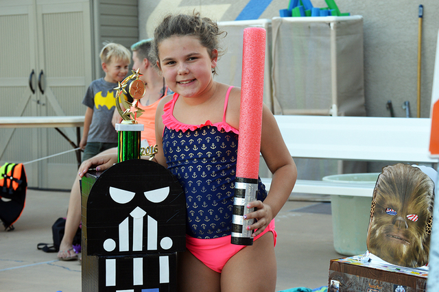 Mikayla Martorano, 10, smiles in front of her award. Mikayla won third place for best Imperial boat during her first year participating in the parks and recreation department's 16th annual Cardboa ...