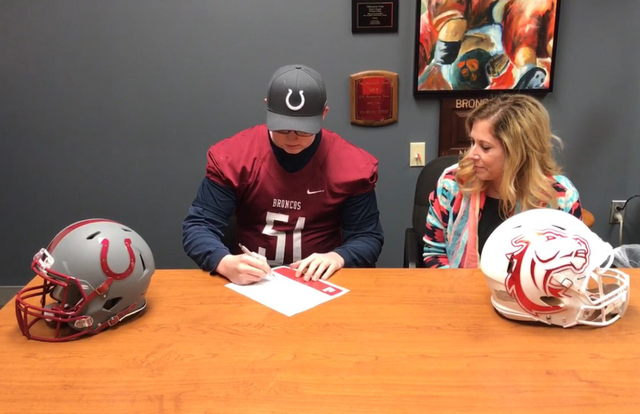 Photo courtesy Tony Harper
Chase Cowley, a senior at Boulder City High School, has signed his national letter of intent to play football at Hastings College in Hastings, Nebraska. Looking on is hi ...