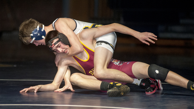 Steve Andrascik/Boulder City Review
Boulder City High School wrestler freshman Ladd Cox applies a head lock to his opponent during the 138-pound contest in the tournament against Del Sol on Tuesda ...