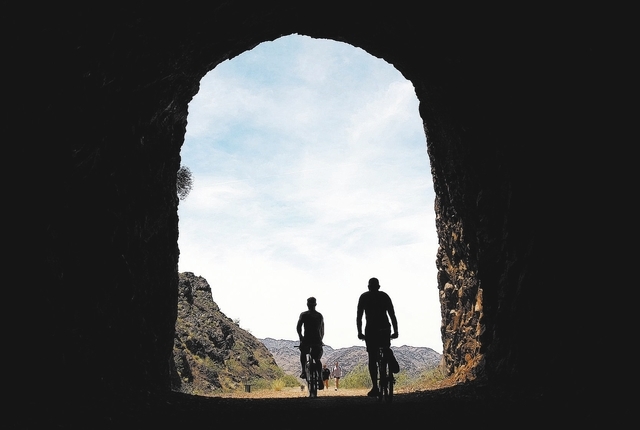 RJ FILE***
JOHN LOCHER/LAS VEGAS REVIEW-JOURNAL
People ride bikes through a tunnel along the Historic Railroad Trail near Lake Mead Tuesday, May 25, 2010. The popular biking and hiking trail, whic ...