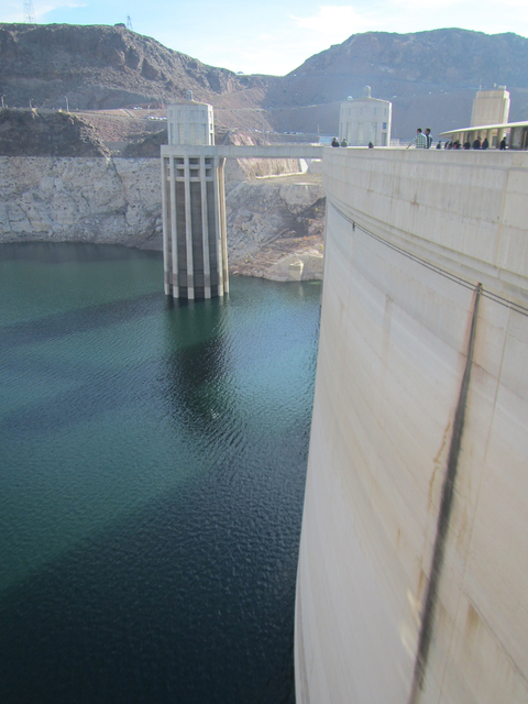 Las Vegas Review-Journal file photo
Tourists walk along the top of Hoover Dam earlier this month. The Bureau of Land Management awarded the Bureau of Reclamation $2.7 to improve the dam's visitors ...