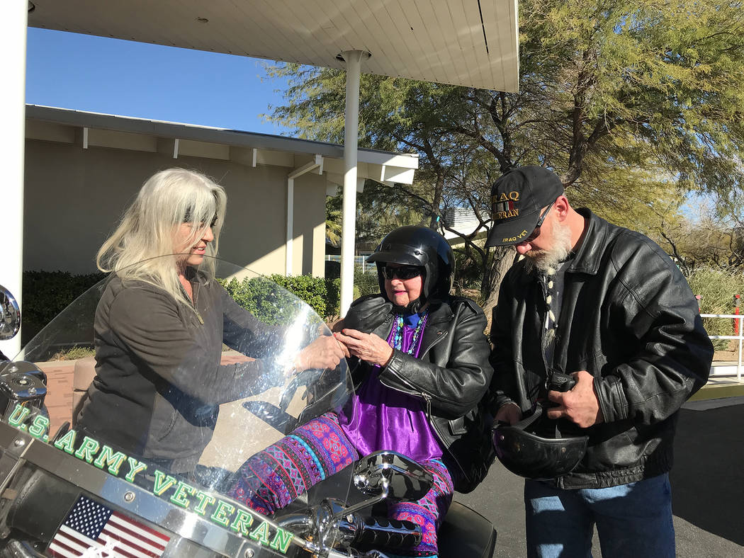 Hali Bernstein Saylor/Boulder City Review
Patty Ashworth, left, helps Rick Hillis, founder of One Hero at a Time, properly outfit Virginia Mahaney, a resident of the Nevada State Veterans Home, fo ...