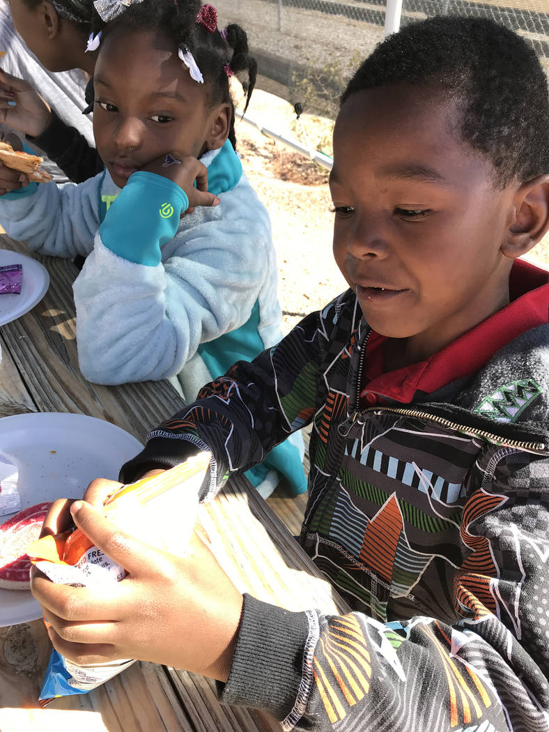 Hali Bernstein Saylor/Boulder City Review
Camille Moore, 7, and her brother Latino "Junior" Moore, 6, enjoy lunch before touring the Nevada State Railroad Museum and going on a rail car adventure  ...