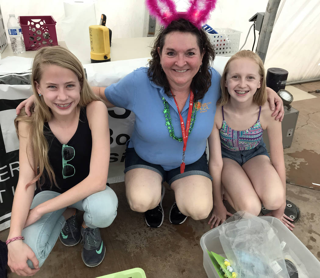 Hali Bernstein Saylor/Boulder City Review
Cheree Brennan, center, aquatic coordinator, was assisted by Josie McClaren, left, and Avery Huysentruyt at Saturday's, March 17, 2018,  Easter Pool Plung ...