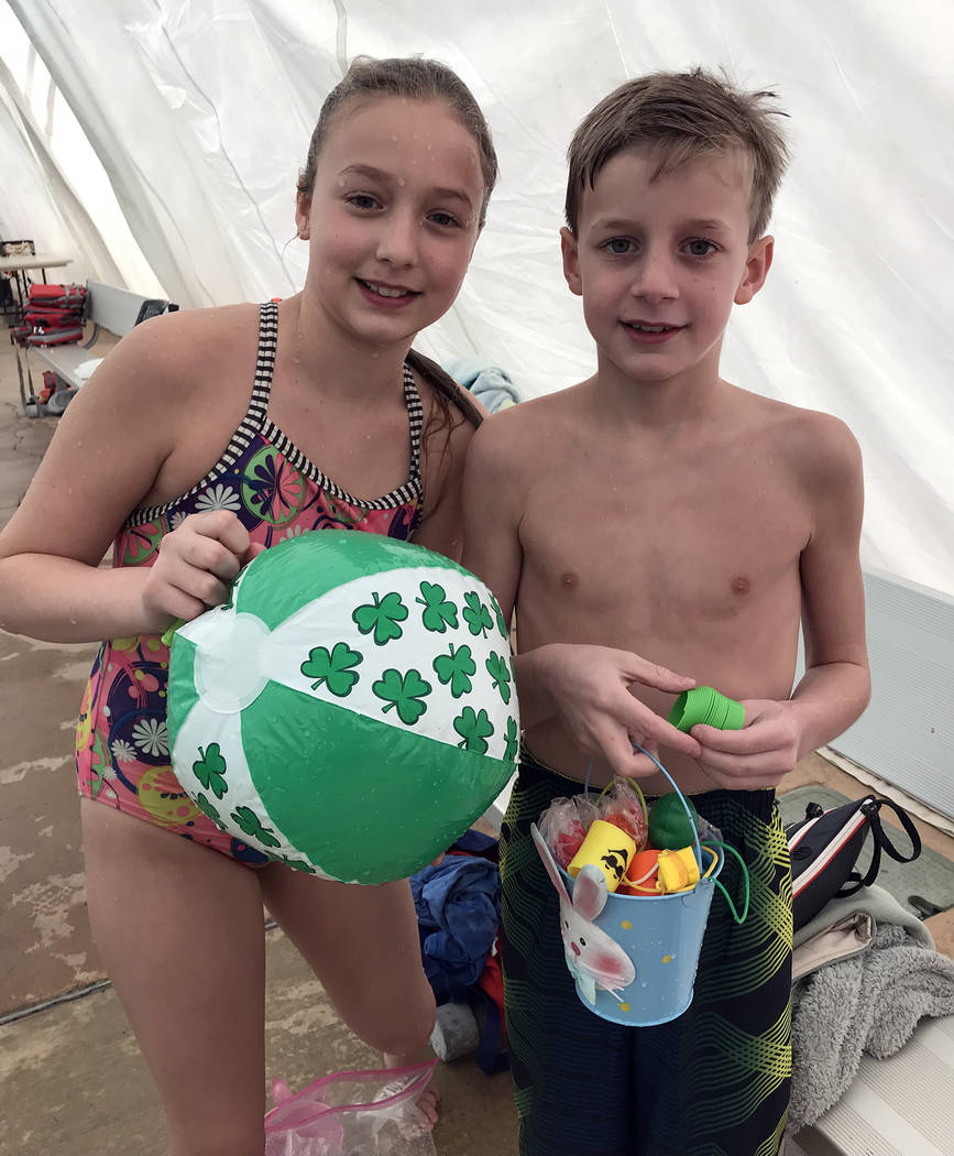 Hali Bernstein Saylor/Boulder City Review
Siblings Kate and Jack Gelb, who were visiting from New York, collected a variety of toys during the third annual Easter Pool Plunge on Saturday, March 17 ...