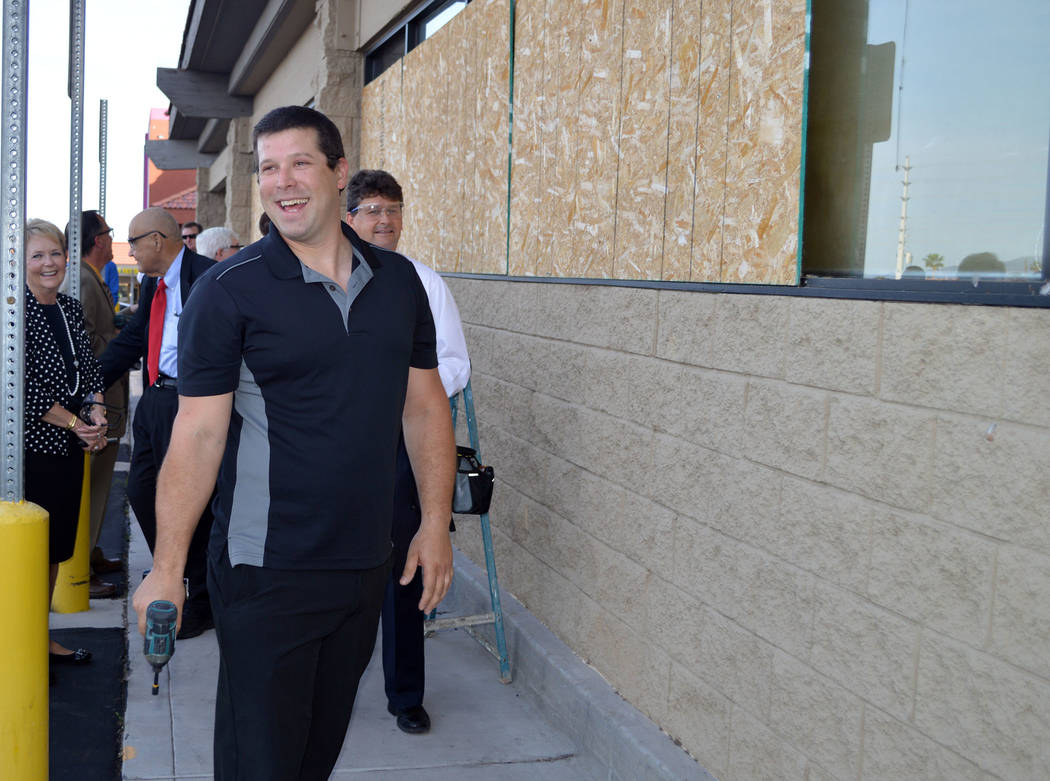 Celia Shortt Goodyear/Boulder City Review
Aaron Medo, vice president of production for Medolac, gets ready to remove the plywood on the company's new facility, which is the site of the old Vons/Ha ...