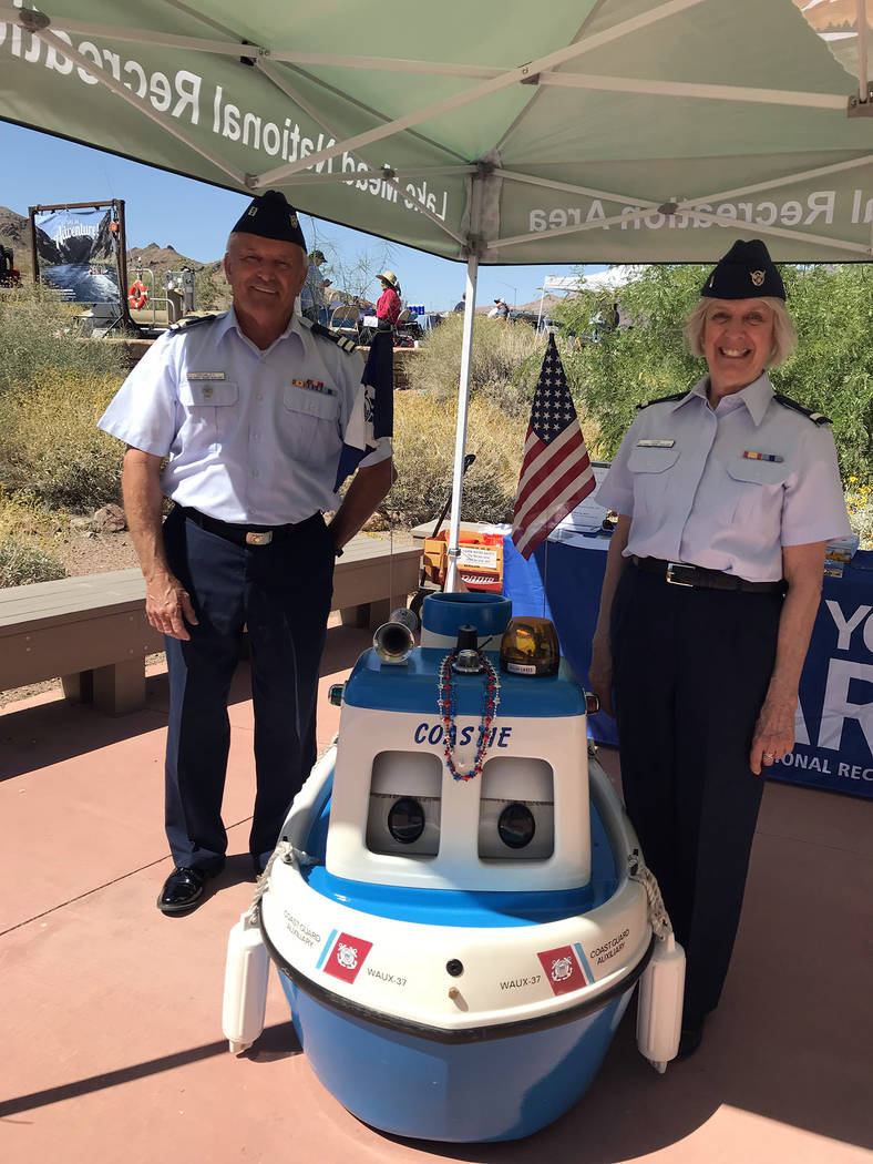 Hali Bernstein Saylor/Boulder City Review Bob Cromley and Wendy Park of the U.S. Coast Guard Auxiliary joined Coastie, the talking boat, to provide information about water safety during Junior Ran ...