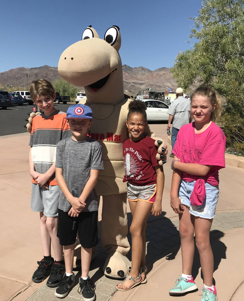 Hali Bernstein Saylor/Boulder City Review Posing for a picture with Mojave Max, the mascot for the Clark County Desert Conservation Program, were, from left, P.J. Alexander, Evan Shumway, Gwen Shu ...