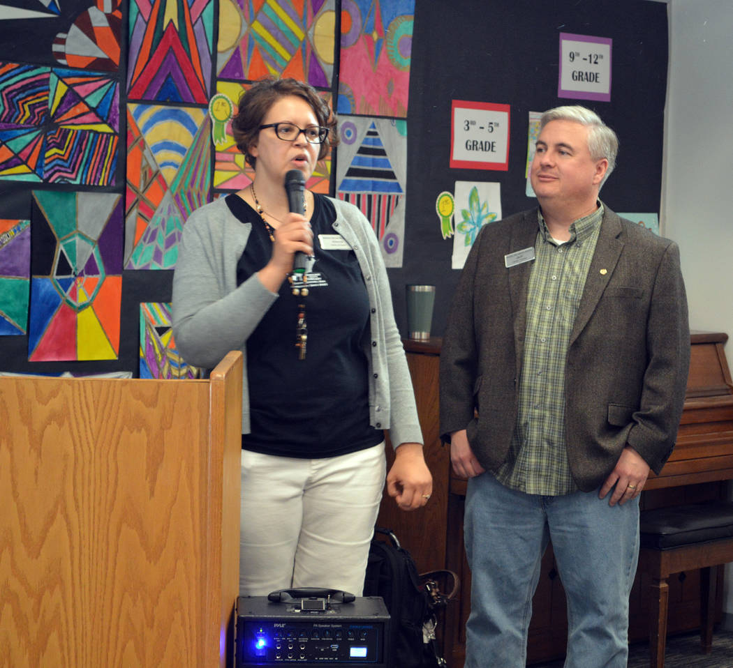 Celia Shortt Goodyear/Boulder City Review Library Director Kim Diehm and Board Chairman Jeff Breeden welcome the community to the library's 75 anniversary celebration on Friday.