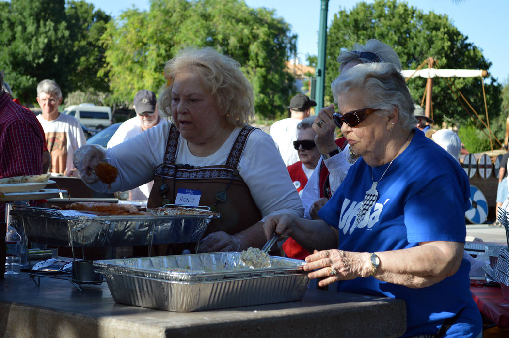 Celia Shortt Goodyear/Boulder City Review Minna Anderson, left, and Agnes Jevne serve Norwegian food to guests at the Sons of Norway Constitution Day celebration May 17 at Bicentennial Park.