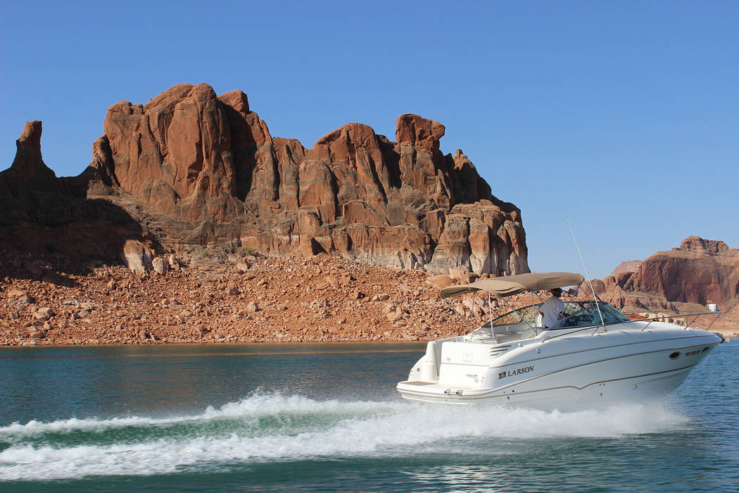 Deborah Wall Lake Powell has 1,800 miles of stunning shoreline, much of it suitable for an easy rest stop, swim, fishing spot or camping the night. The lake is within the Glen Canyon National Recr ...