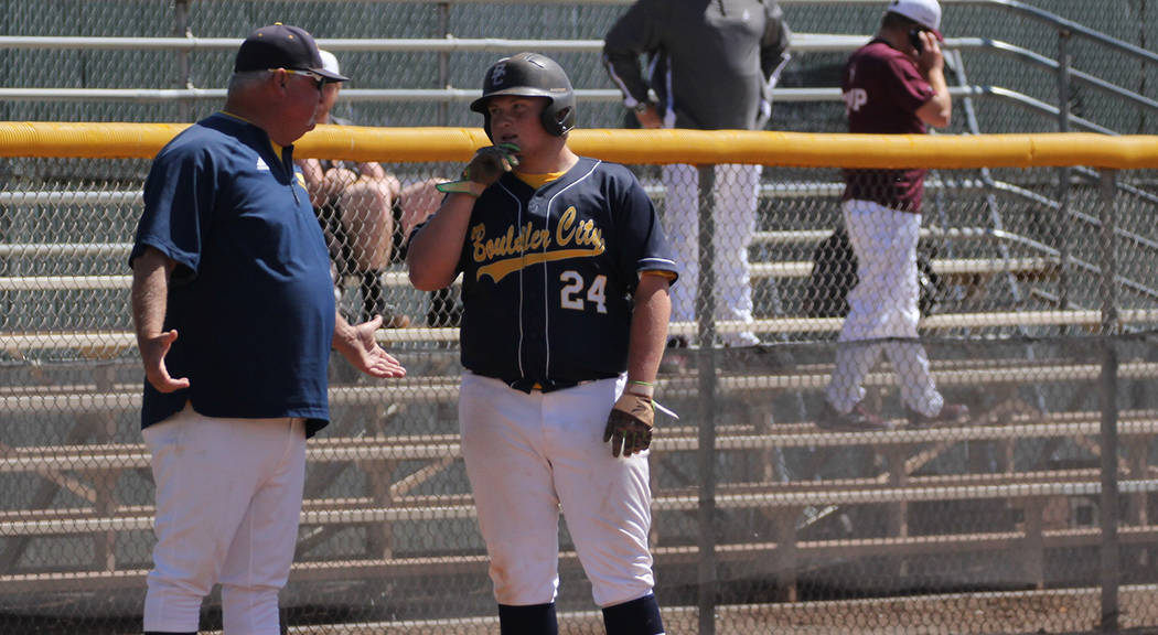 Boulder City High School yearbook Boulder City High School senior Nolan Herr, left, confers with head coach Ed McCann during the Eagles' season-ending 9-5 loss against Pahrump Valley during their ...