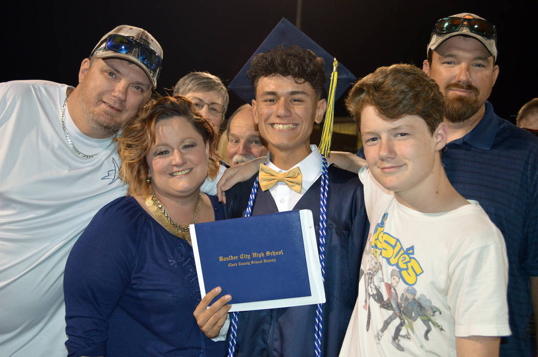 Celia Shortt Goodyear/Boulder City Review One of Boulder City High School's newest graduates, Gabriel Lawrence, center, celebrates with his family, from left, Will Anderson, Valaree Anderson, Nola ...
