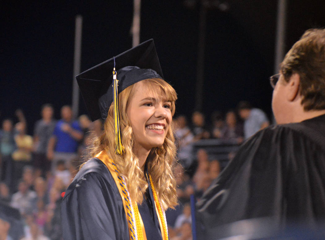 Celia Shortt Goodyear/Boulder City Review Lauren Stewart accepts her diploma Friday at Boulder City High School's 77th annual commencement.