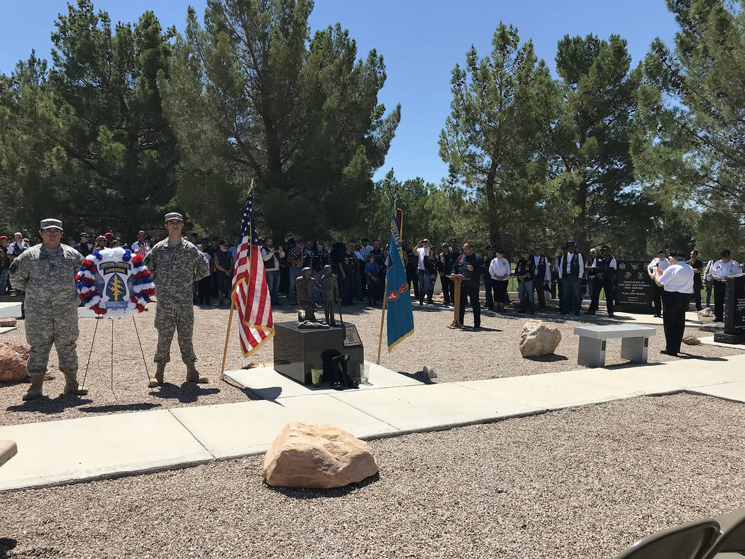 Hali Bernstein Saylor/Boulder City Review Arrow, president of the Vietnam Vets Legacy Vets Motorcycle Club, addresses fellow riders and members of the Special Forces Association, Chapter 51, who c ...