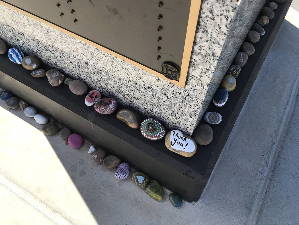 Hali Bernstein Saylor/Boulder City Review Painted rocks with messages of appreciation for our nation's veterans are seen on Sunday at the base of a memorial at the Southern Nevada Veterans Memoria ...