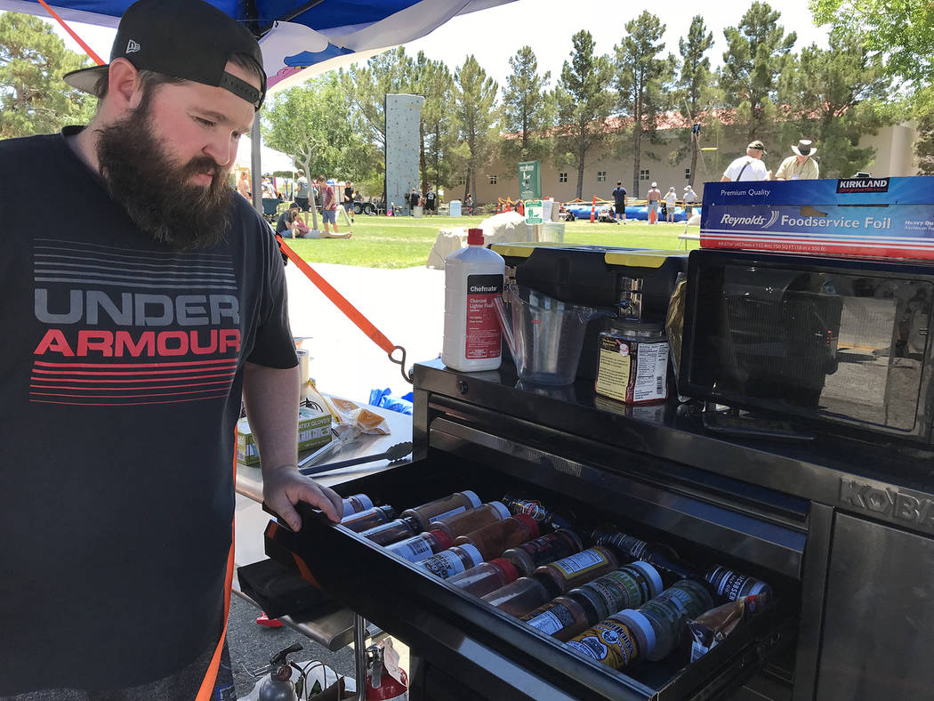 Hali Bernstein Saylor/Boulder City Review Dave Hanson of Crooked Pig of Boise, Idaho, shows off a tool box he converted into a spice rack at the Best Dam Barbecue Challenge on Saturday, May 26, 2018.