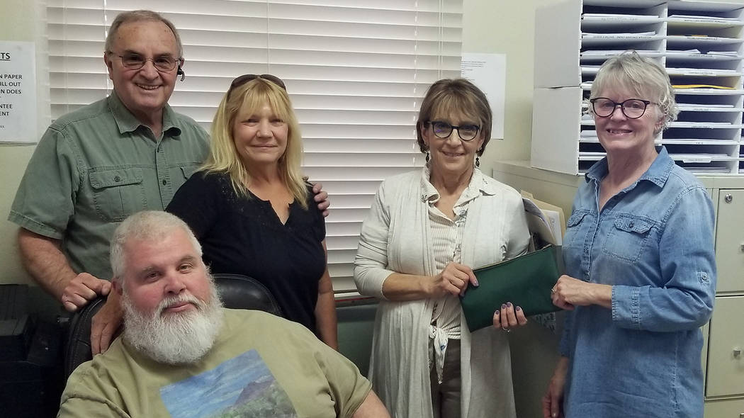 Emergency Aid of Boulder City Kathleen Wall, far right, recently presented a $1,300 donation to Emergency Aid of Boulder City. She offers a yoga class on Mondays at the Elaine K. Smith Center, wit ...