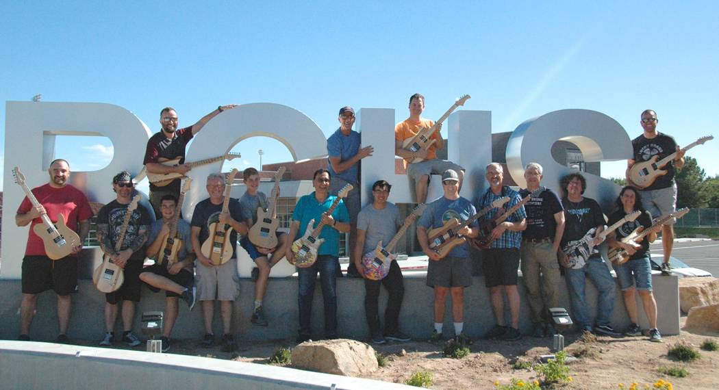 Jayme Sileo/Boulder City Review After finishing their electric guitars, members of the summer STEM Guitar institute, front row, from left, Ryan Capps, Jeff Hinton, Bret Stewart, Jim Berry, Jake Tr ...