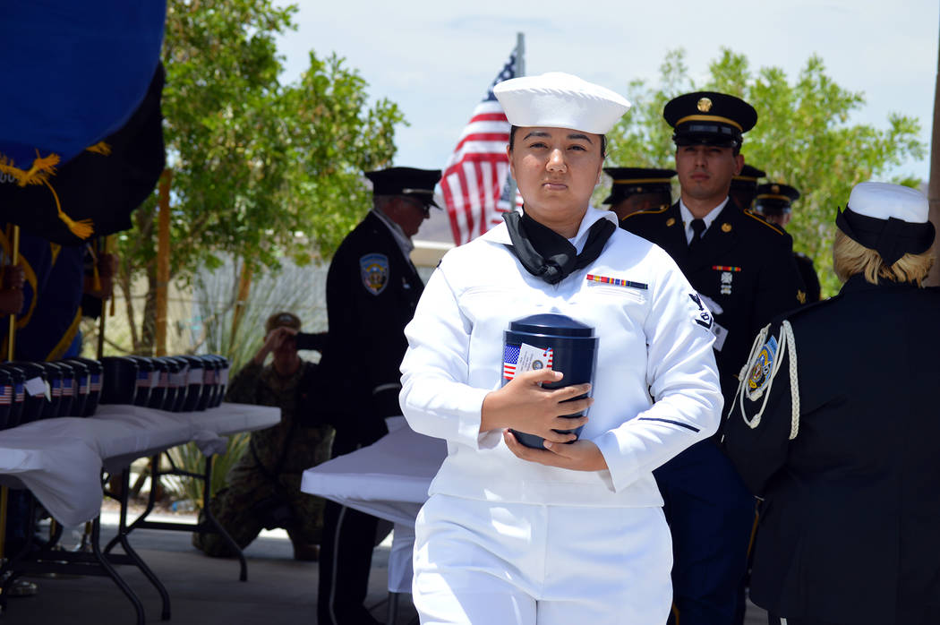 Celia Shortt Goodyear/Boulder City Review U.S. Navy Petty Officer 3rd Class Riceal Synnes carries the remains of Victor Forbush, who was a member of the U.S. Navy from 1926 to 1945 and fought in W ...