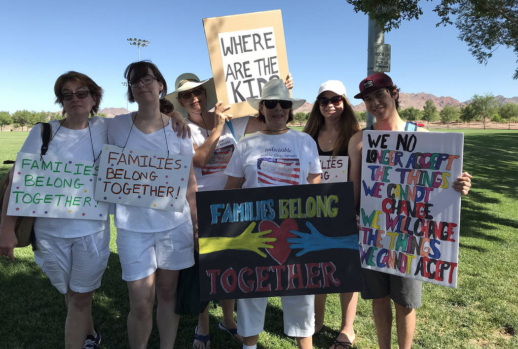 Hali Bernstein Saylor/Boulder City Review Getting ready to march in the Save Our Children event Saturday to protest separating children from their parents as part of President Donald Trump's immig ...