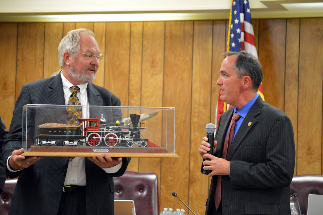 Celia Shortt Goodyear/Boulder City Review Celia Shortt Goodyear/Boulder City Review Community Development Director Michael Mays, right, presents Randy Hees, director of the Nevada State Railroad ...