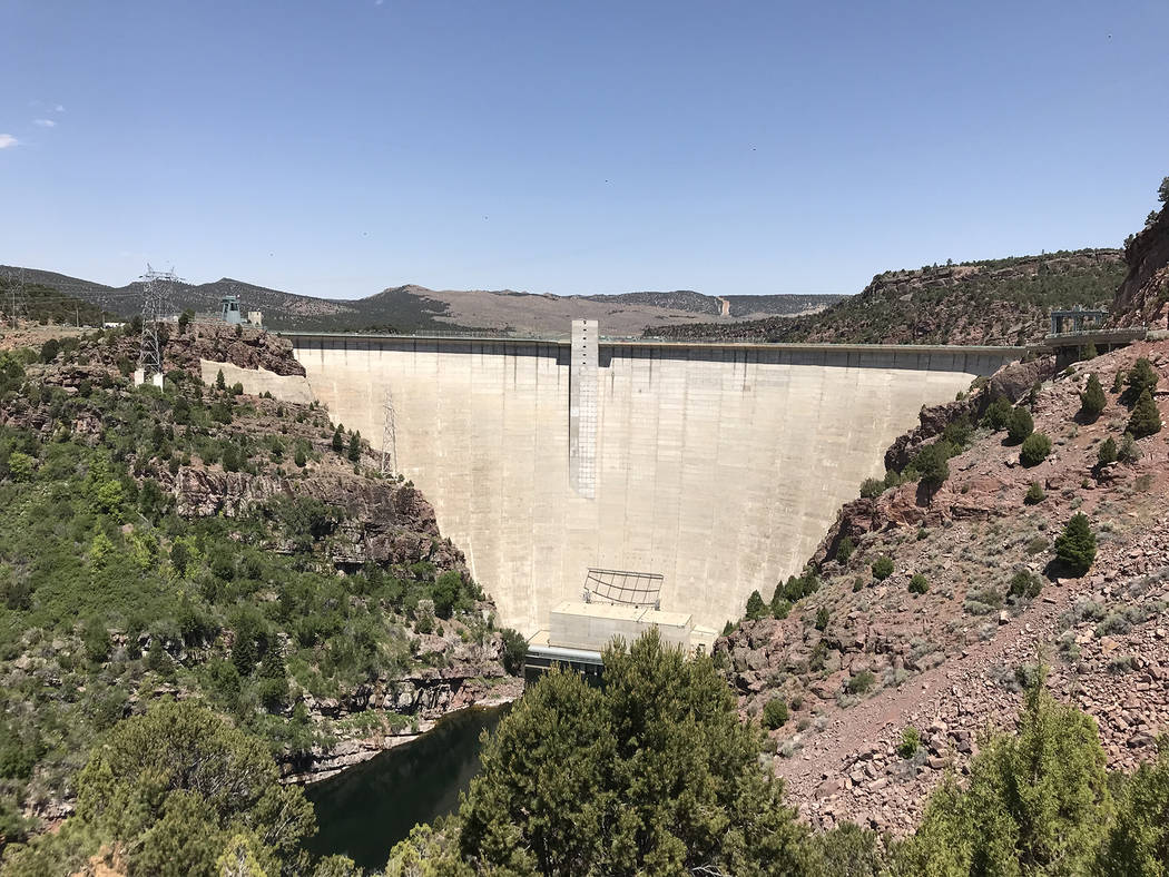Deborah Wall The Flaming Gorge Dam in northern Utah is a thin-arch concrete dam that is 502 feet high from the streambed below. It was completed in 1964, which impounded the Green River to the north.