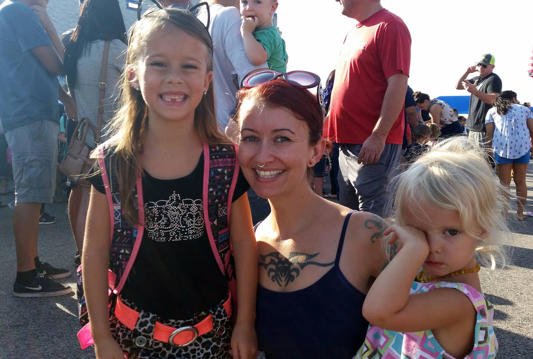 Celia Shortt Goodyear/Boulder City Review First-grader Leida Andrews, left, lines for class on the first day of school Monday at Mitchell Elementary School in Boulder City. Her mom, Brandi, center ...