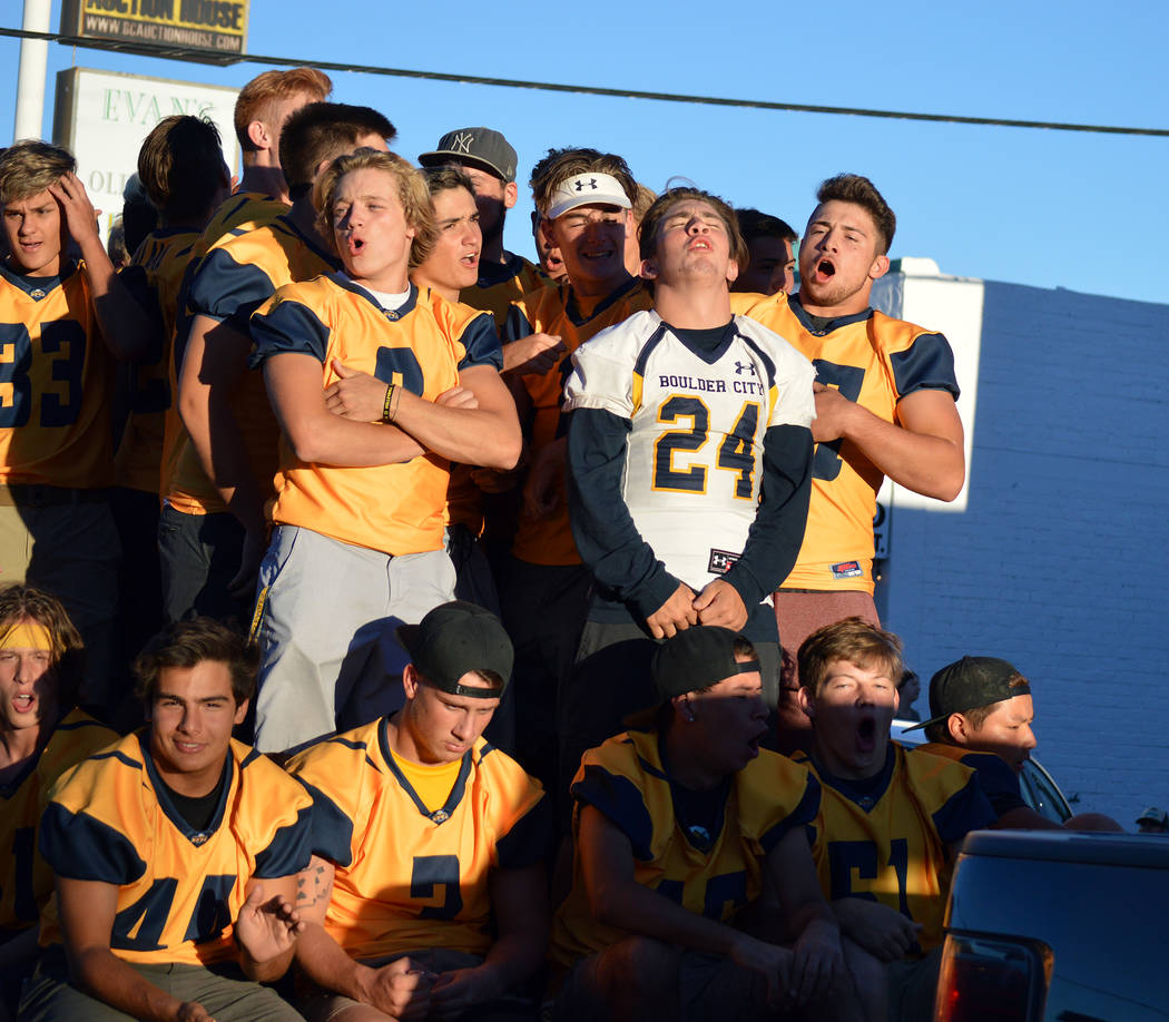 Celia Shortt Goodyear/Boulder City Review Members of the Boulder City High School football team cheer and chant during the 2018 homecoming parade in downtown Boulder City on Sept. 13.