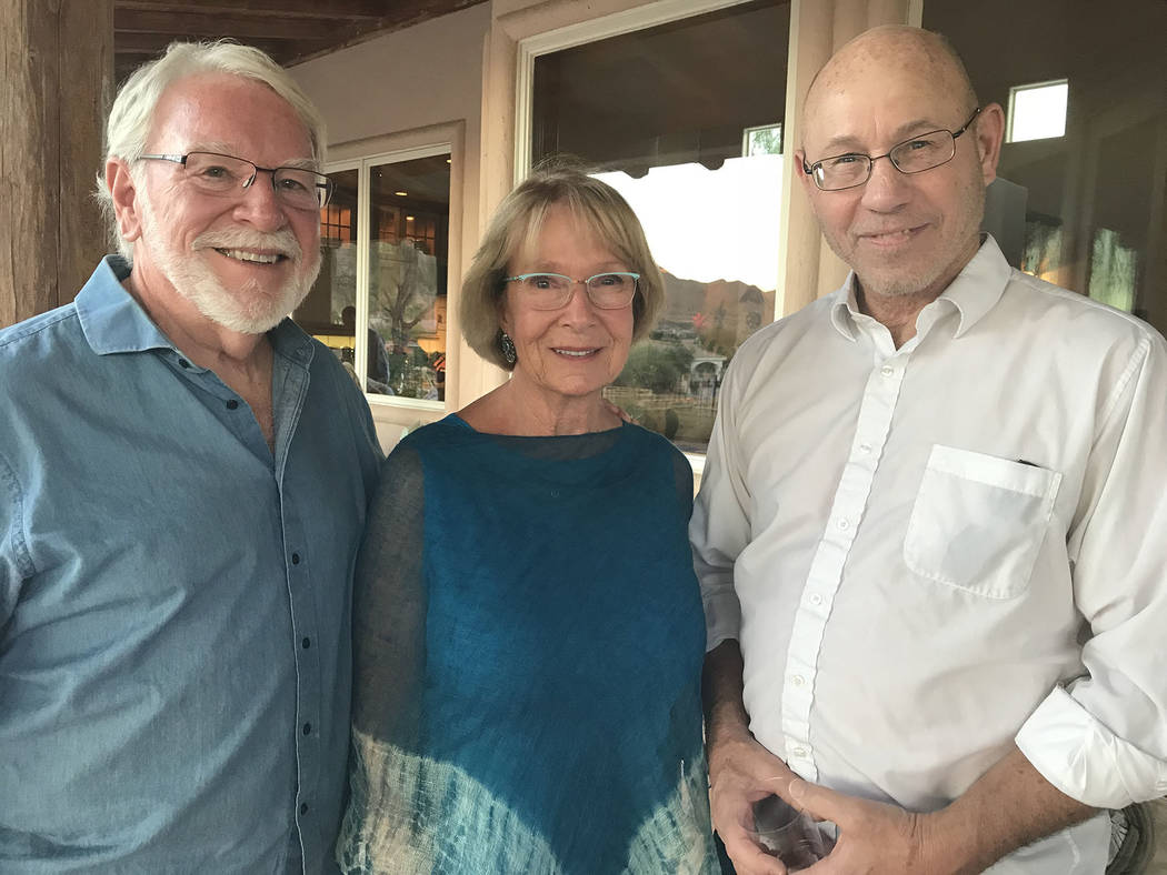Hali Bernstein Saylor/Boulder City Review Chautauqua scholar Doug Mishler, right, visits with Jim Amstutz and Linda Faiss, who hosted a special event Friday at their home to meet the University of ...