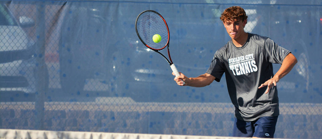 Robert Vendettoli/Boulder City Review Boulder City High School junior doubles player Preston Jorgensen returns a serve from Moapa Valley on Monday. He and partner, Boen Huxford, went 3-0 for the day.