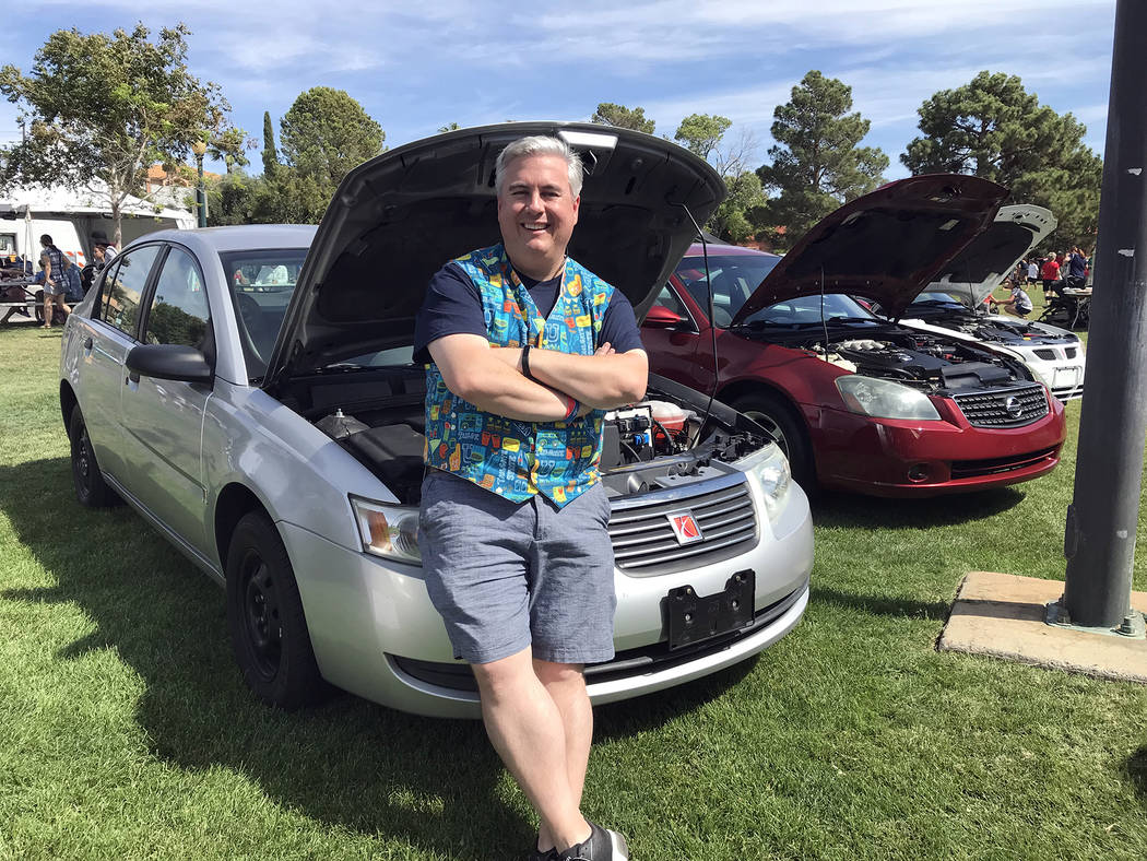 Hali Bernstein Saylor Jeff Breeden, president of the Boulder City Sunrise Rotary, takes a break from the activities at Saturday Wurst Festival to check out a few of the vehicles that were set to b ...