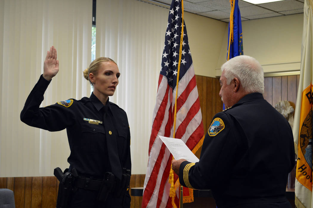 Celia Shortt Goodyear/Boulder City Review Boulder City Police Chief Tim Shea swears in officer Tiffany Driscoll as one of two new sergeants on Monday, Oct. 1, at City Hall.