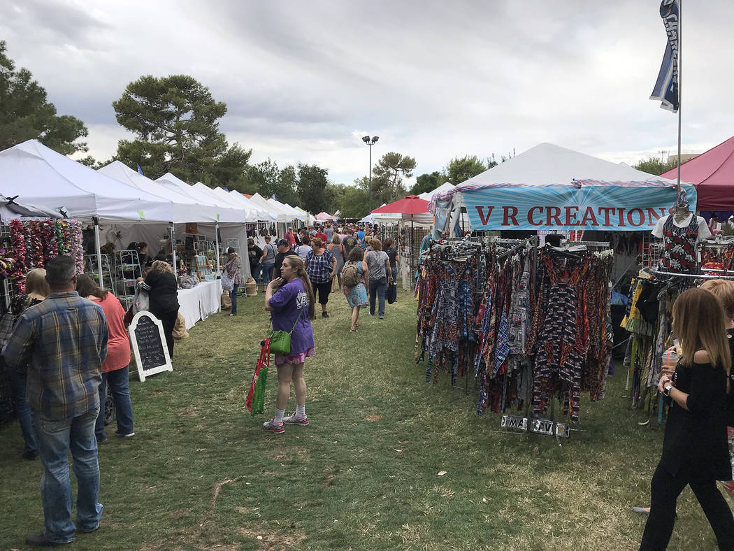 Hali Bernstein Saylor/Boulder City Review Cloudy skies and a few drops of rain didn't deter visitors from enjoying the variety of arts and crafts booths at Art in the Park on Saturday, Oct. 6, 201 ...