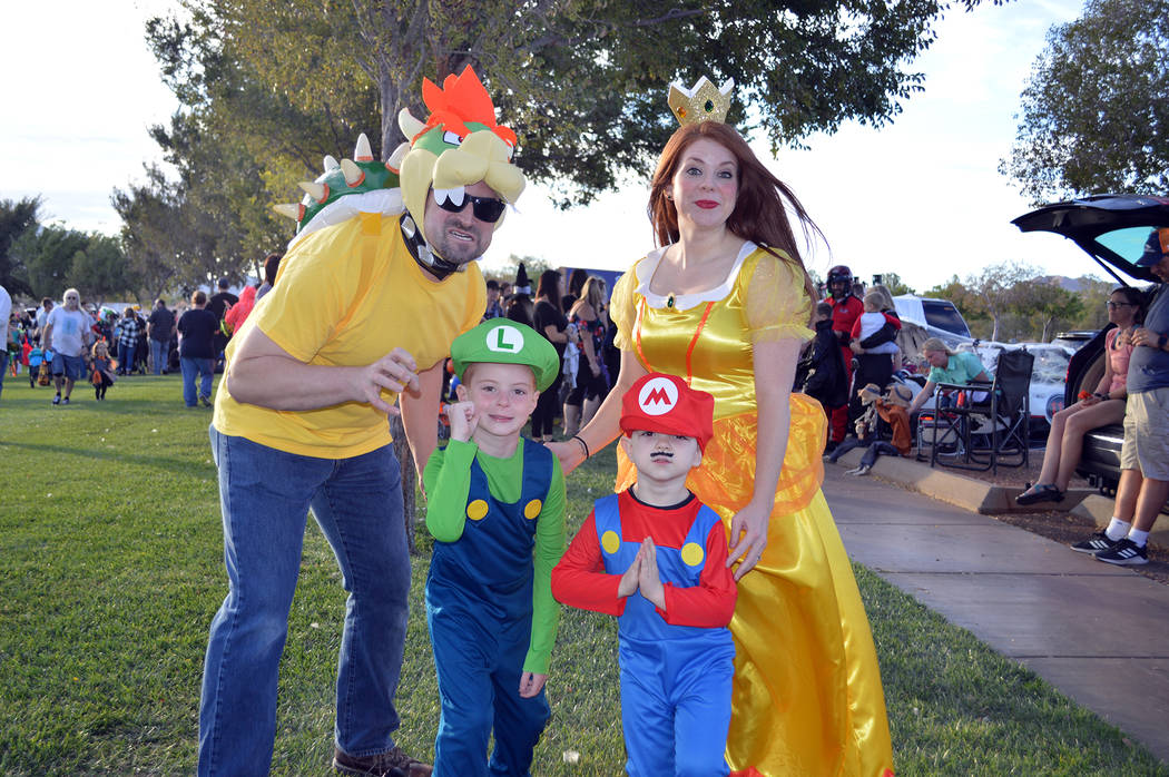 Celia Shortt Goodyear/Boulder City Review The Hallam family came to Boulder City Chamber of Commerce's annual Trunk or Treat on Oct. 13. Amanda Hallam, right, said the boys wanted them all to dre ...