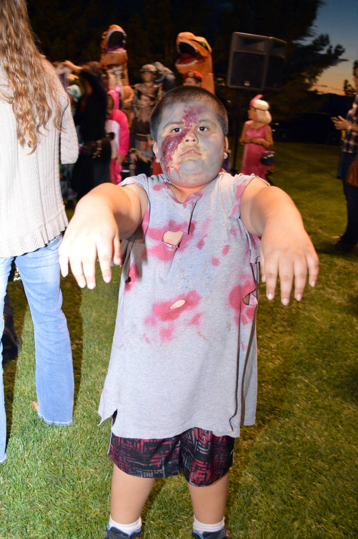 Celia Shortt Goodyear/Boulder City Review Raymond Delacruz portrayed a zombie at Trunk or Treat on Saturday, Oct. 13, at Veterans' Memorial Park. His costume earned second place for children ages ...