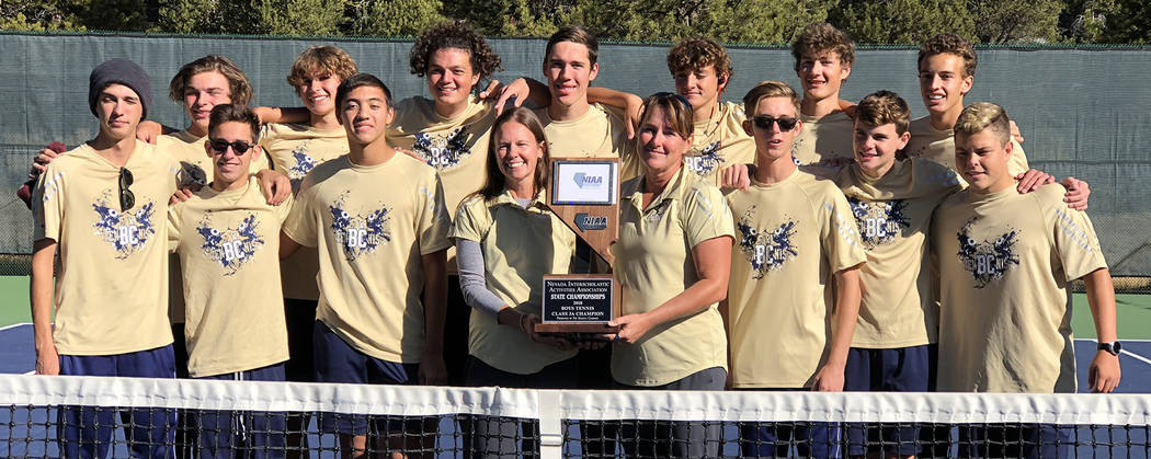 Andrew Huxford Members of Boulder City High School boys tennis team show off their championship trophy after winning the 3A state title for the second consecutive year on Friday, Oct. 19.