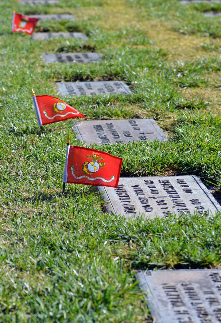 (Celia Shortt Goodyear/Boulder City Review) Volunteers and members of the Marine Corps League of Henderson placed approximately 700 United States Marine Corps flags on the graves of the military b ...