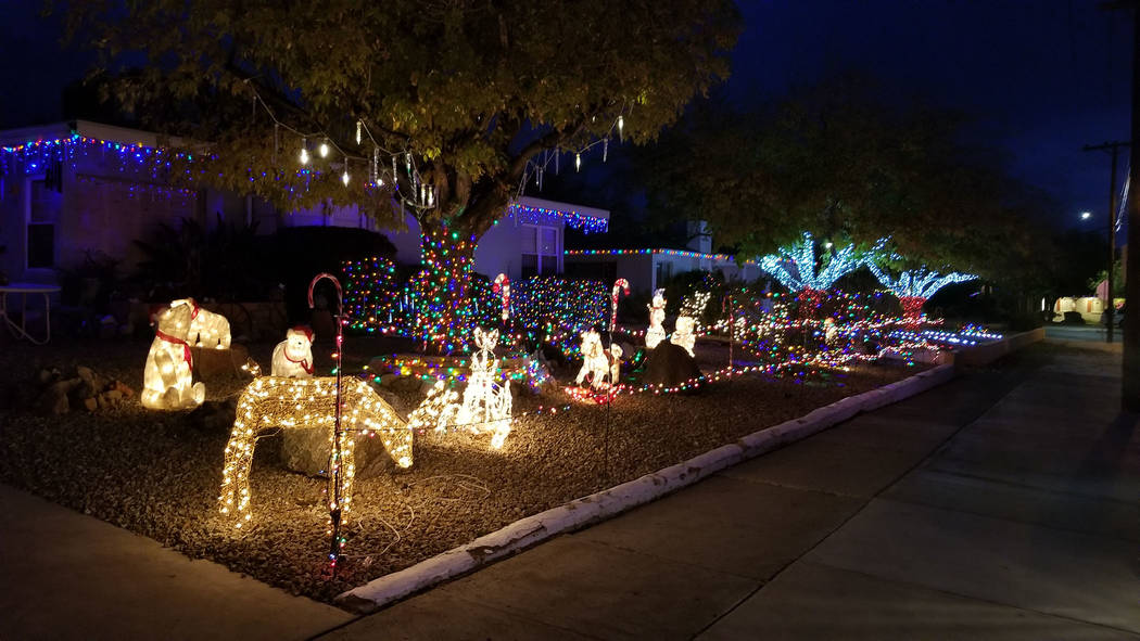 (Celia Shortt Goodyear/Boulder City Review) In addition to the large display at 1525 Fifth St., other houses along the street have been decorated for Christmas. Many include candy canes, icicle li ...