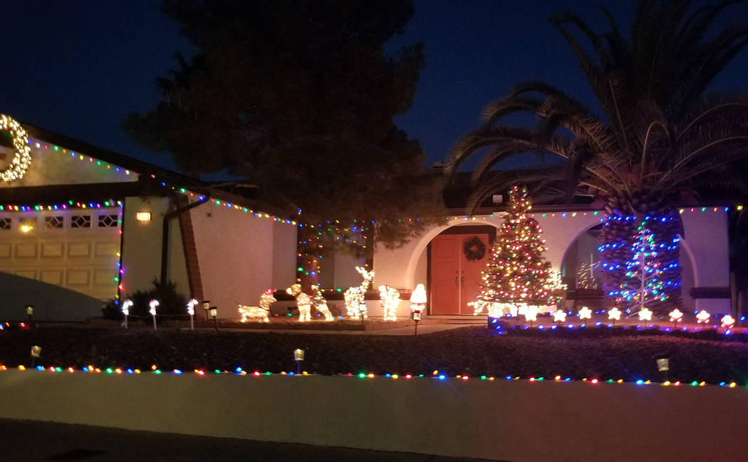 (Celia Shortt Goodyear/Boulder City Review) Houses on Darlene Way include all types of Christmas decorations including this one with a lighted Christmas tree and animals.