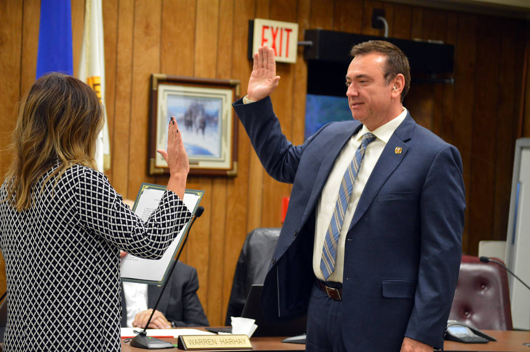 Deputy City Clerk Tami McKay swears in Boulder City's new City Manager, Al Noyola, at a City Council meeting in March.
