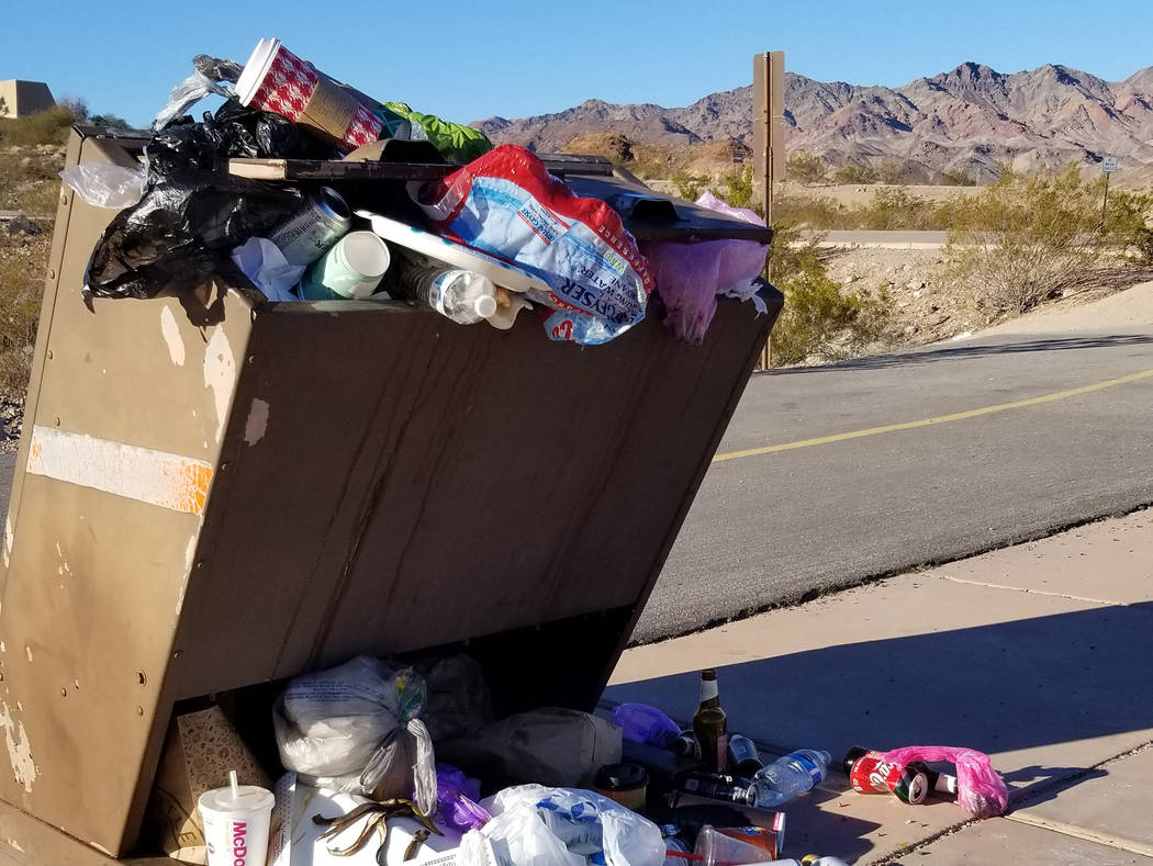 (Celia Shortt Goodyear/Boulder City Review) The trash can at the start of the Historic Railroad Trail in Lake Mead National Recreation Area is overflowing as trash service is not taking place duri ...
