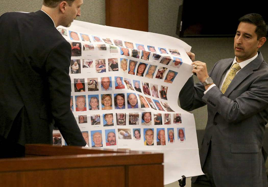 (K.M. Cannon/Las Vegas Review-Journal) Senior Deputy Attorney General Daniel Westmeyer, left, and Chief Deputy District Attorney J.P. Raman set up a display showcasing victims before the sentencin ...