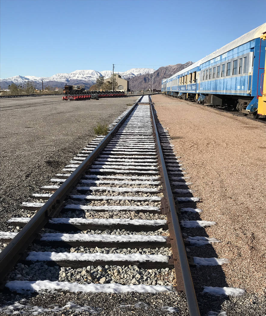 (Hali Bernstein Saylor/Boulder City Review) Snow melts on the tracks of the Nevada State Railroad Museum in Boulder City on Monday, Feb. 18, 2019, after about an inch fell Sunday night. The mounta ...