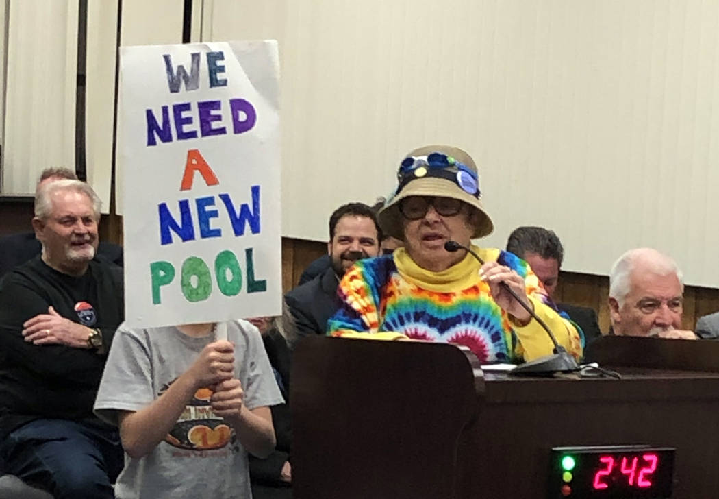 Boulder City Jan Miller and her grandson show their support of a new pool during Tuesday's City Council meeting on Feb. 26.