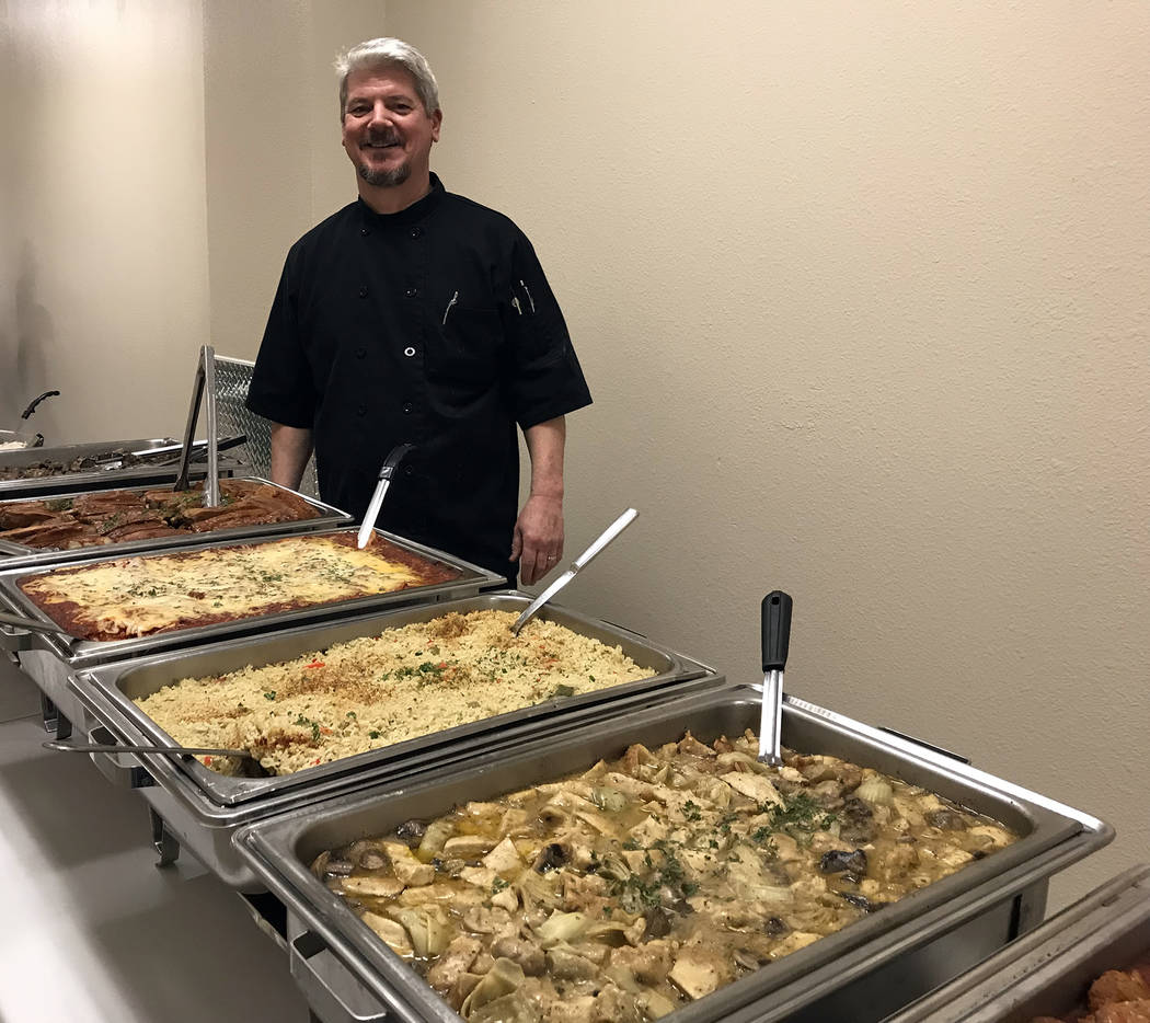 (Hali Bernstein Saylor/Boulder City Review) Evan Lathouris of Evan's Old Town Grille makes sure everything is in place for the Boulder Dam Credit Union's annual membership meeting and dinner. He h ...