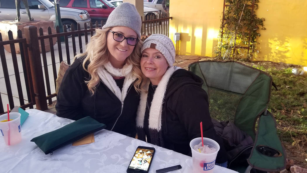 (Celia Shortt Goodyear/Boulder City Review) Debbie Good, left, and Kristen Byars man the ticket table at Two Wheels Garage Grill for the third annual Xi Zeta Rosie Roll pub crawl on Friday, Feb. 22.