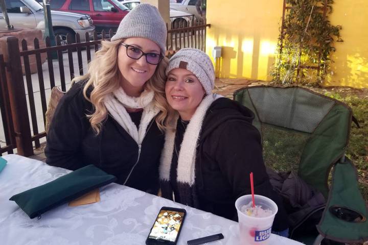 (Celia Shortt Goodyear/Boulder City Review) Debbie Good, left, and Kristen Byars man the ticket table at Two Wheels Garage Grill for the third annual Xi Zeta Rosie Roll pub crawl on Friday, Feb. 22.