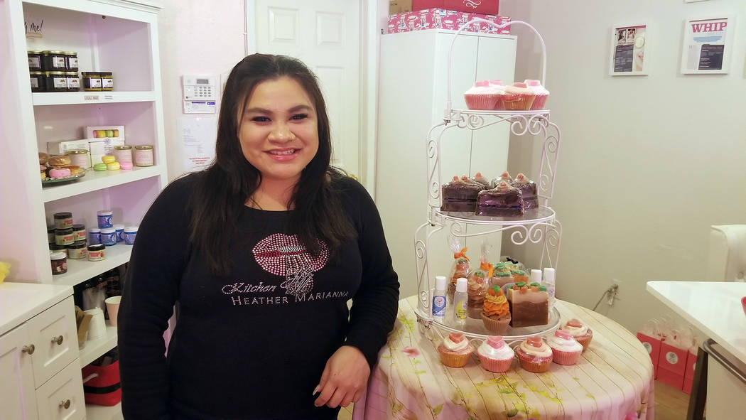 (Celia Shortt Goodyear/Boulder City Review) Nicole Kaauamo gets ready to greet visitors at Beauty Kitchen Boutique during the third annual Xi Zeta Rosie Roll pub crawl on Friday, Feb. 22. The stor ...